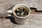 Mold in the unwashed cup after cup of coffee on grungy wooden background