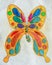 Molding of plasticine on a sheet of paper, in the form of a butterfly pattern.