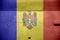 Moldova flag depicted on side part of military armored helicopter closeup. Army forces aircraft conceptual background