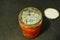 A moldy glass jar of expired orange jam. improper storage of jam