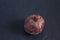 Moldy pomegranate fruit on a dark background. Copy space