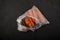 Moldy spoiled carrots in plastic bag. Dark background, copy space. Ugly rotten vegetables. Improper food storage. Concept -