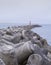 Mole and wave breaker at lighthouse at harbor of Peniche, Portugal