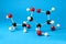 Molecule of glucose on light blue background. Chemical model