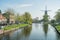 Molen De Valk windmill and cityscape