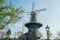 Molen De Valk windmill and cityscape