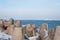 Moles with lighthouses and frozen concrete tetrapods on a winter day, Ventspils, Latvia