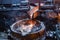Molten iron flow. Liquid metal is poured into the ladle in a thin stream