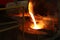 Molten iron pour from ladle into melting furnace