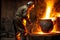 Molten metal boiling in large vat in workshop of plant of foundry industry