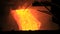 Molten metal pouring out of furnace. Liquid metal from blast furnace