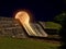 Molten Moon Flowing over Edge of Dam