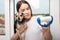 Molting. Dog hair. Girl holds pet, looks at wool, is surprised