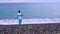 Mom with a baby walks along the beach 4k