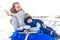 Mom with a boy son 3 years old, in winter in a pair on a hill, an inflatable toy for skiing tubing, fresh air. Holiday