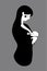 Mom breastfeeds her baby. Silhouette of a mother with a baby in her arms, motherhood concept. Breastfeeding logo, sign