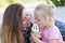 Mom and child eat ice cream, happy family moment