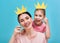 Mom and child are holding crown