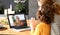 Mom and child making talking with grandma through video call on laptop