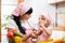 Mom and child preparing healthy food at kitchen