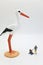 mom with child and a stork miniature figurines