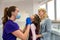 Mom and child visit their pediatric dentist. Doctor talking with patient