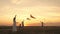 Mom with children plays in kites at sunset in the park. Outdoor family game. mother and healthy daughters are launching