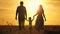 Mom, dad and baby play outdoors. healthy little daughter jumps and flies in arms of mother and father in field at sunset