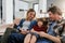 Mom, dad and happy family relax on sofa in living room with love, quality time and chat together at home. Young boy