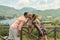 Mom and Dad kiss their daughter on the background of a mountain lake Lago del Turano - happy family