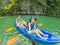 Mom, dad and son travelers rowing on a kayak in Halong Bay. Vietnam. Travel to Asia, happiness emotion, summer holiday