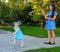 Mom and daughter blow bubbles