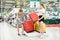 Mom and daughter choose suitcase to travel in store