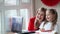 Mom and daughter congratulate on Valentines Day via a laptop via video communication. The holiday on February 14