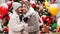 mom and daughter with dog Papillon near Christmas tree on street. photo shoot