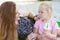 Mom and daughter eat ice cream. Happy family moment