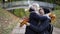 Mom and daughter embrace in the autumn park.