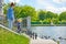 Mom and daughter feed bread crumbs to ducks and gulls on the city pond.