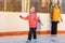 Mom and daughter on the ice rink