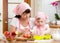 Mom and daughter making apple pie together