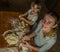 Mom and daughter are making flour out of flour to cook dumplings