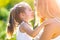 Mom and daughter outside. Happy loving family mother and daughter in spring.