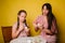 Mom and daughter paint eggs for Easter. A believing woman and a child girl preparing for a religious holiday