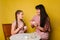 Mom and daughter paint eggs for Easter. A believing woman and a child girl preparing for a religious holiday