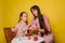 Mom and daughter paint eggs for Easter. A believing woman and a child girl preparing for a religious holiday