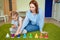 Mom and daughter playing colourful musical bells