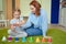 Mom and daughter playing colourful musical bells