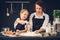 Mom and daughter preparing dumplings in the kitchen