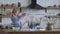 Mom and daughter are preparing a pie in the kitchen. woman and girl clap their hands and flour flies through the kitchen