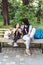 Mom and daughter rest on the bench